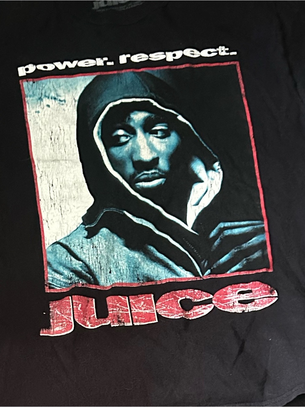 Black Graphic Tee with Blue Portrait and Red 'juice' Text